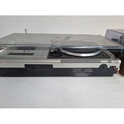 451 - Two vintage stereo music centres, one Sharp SG-220E comprising two speed turntable, cassette deck an... 