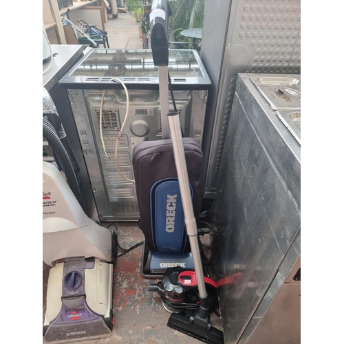 586 - Two items, one Vytronix handheld vacuum cleaner and one Oreck U3805HHPDQ upright vacuum cleaner