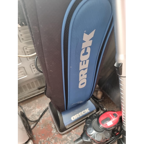 586 - Two items, one Vytronix handheld vacuum cleaner and one Oreck U3805HHPDQ upright vacuum cleaner