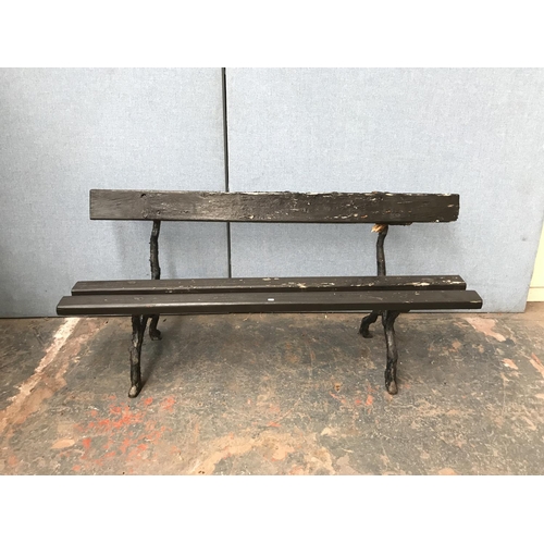 697 - A Victorian Coalbrookdale style cast iron and wooden slatted garden bench