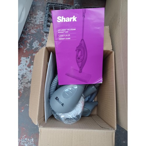 581 - Two cleaners with attachments, one boxed Electrolux Lite vacuum and one Shark floor and handheld ste... 