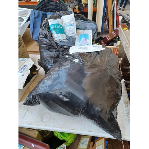 673 - Two bags containing a large quantity of 3 ply surgical masks