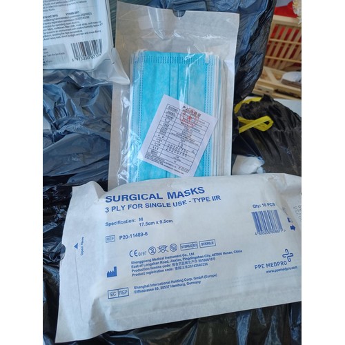 673 - Two bags containing a large quantity of 3 ply surgical masks