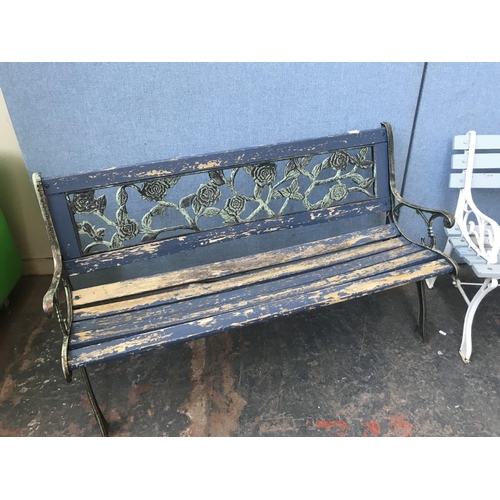 692 - Two cast metal and wooden slatted garden benches