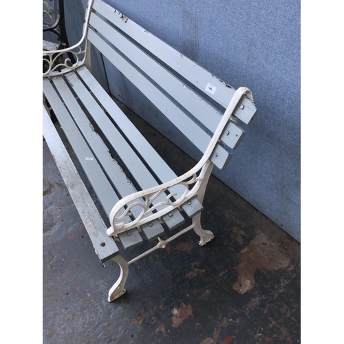 692 - Two cast metal and wooden slatted garden benches