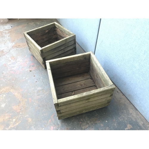 694 - Two weathered pine square garden planters - approx. 33cm high x 50cm square