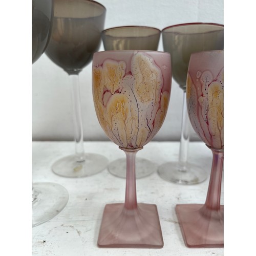 180A - A collection of studio glass to include four Simron hand painted 16cm wine glasses, John Lewis purpl... 