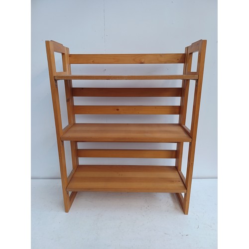 50A - A modern pine three shelf folding bookcase