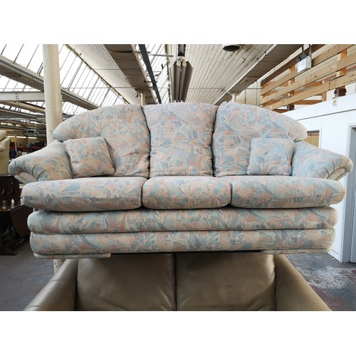 25A - A 1990s floral upholstered three seater sofa