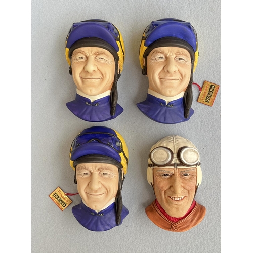 64 - Four boxed Bossons hand painted chalkware head wall plaques, three Jockey and one Nuvolari