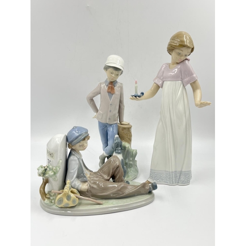 11 - Three Spanish porcelain figurines, two Nao by Lladro and one Lladro A Time To Rest, model no. 5399 -... 