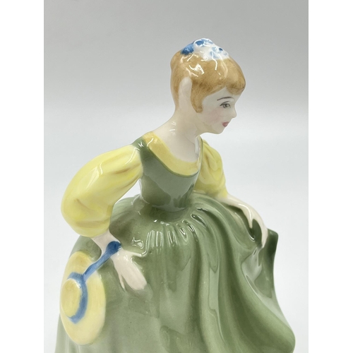 23 - Four Royal Doulton figurines comprising Top O' The Hill HN 1834, Fair Maiden HN 2211, Sophie HN 2833... 