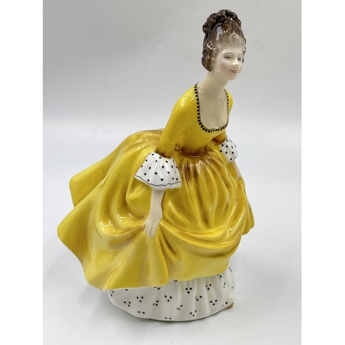 25 - Three Royal Doulton figurines comprising April HN 3693, Soiree HN 2312 and Coralie HN 2307