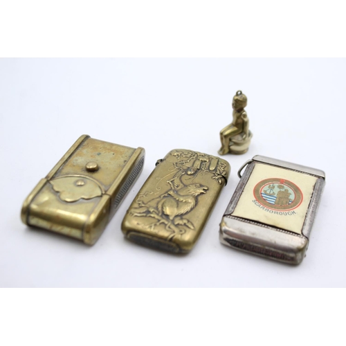 1340 - Four vintage smoking accessories comprising two brass vesta cases, brass cigar cutter and Scarboroug... 