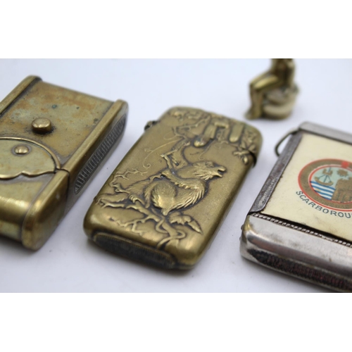 1340 - Four vintage smoking accessories comprising two brass vesta cases, brass cigar cutter and Scarboroug... 