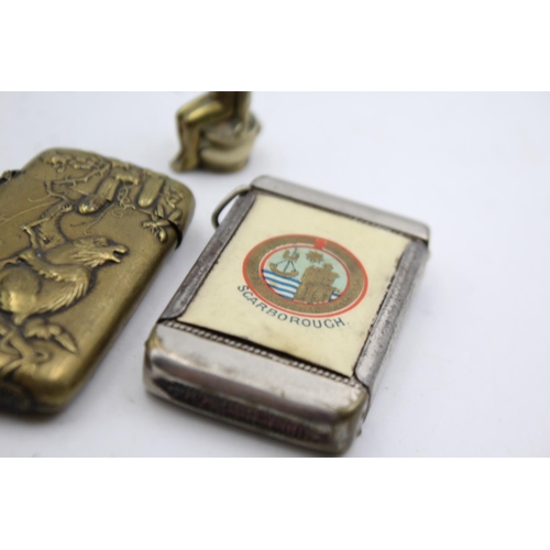 1340 - Four vintage smoking accessories comprising two brass vesta cases, brass cigar cutter and Scarboroug... 