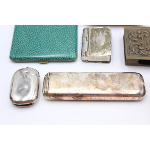 1344 - Eight antique smoking related items comprising one silver plated cigar holder, three vesta cases, tw... 