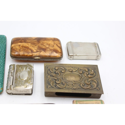 1344 - Eight antique smoking related items comprising one silver plated cigar holder, three vesta cases, tw... 