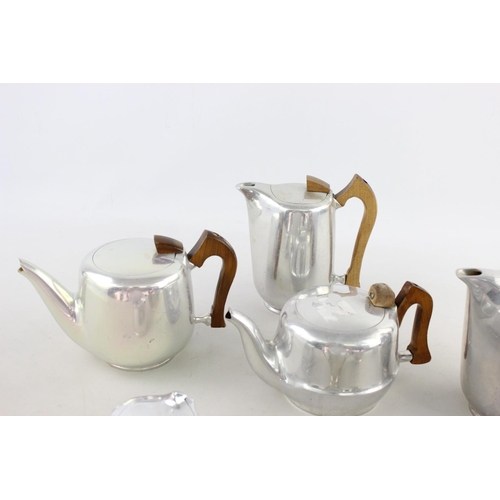 198 - Eight pieces of vintage Picquot Ware to include teapot, sugar bowl, jugs etc.