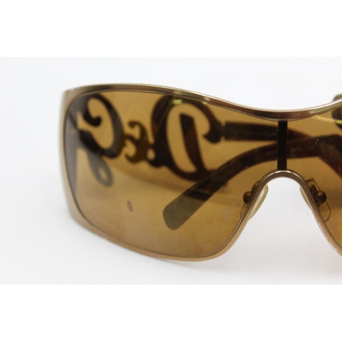 275 - A pair of women's Dolce & Gabbana bronze oversized 00's style sunglasses with brown lenses