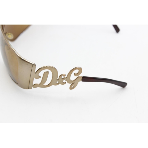 275 - A pair of women's Dolce & Gabbana bronze oversized 00's style sunglasses with brown lenses