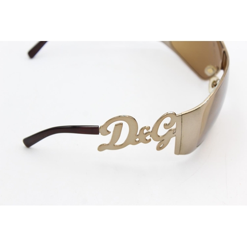 275 - A pair of women's Dolce & Gabbana bronze oversized 00's style sunglasses with brown lenses