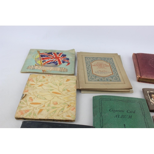 295 - A collection of vintage cigarette card albums to include Wills's Roses, Garden Life, Aviation, Crick... 