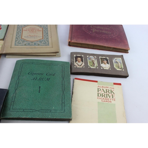 295 - A collection of vintage cigarette card albums to include Wills's Roses, Garden Life, Aviation, Crick... 