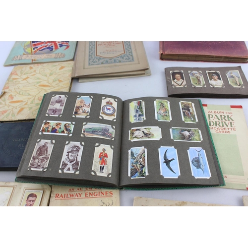 295 - A collection of vintage cigarette card albums to include Wills's Roses, Garden Life, Aviation, Crick... 