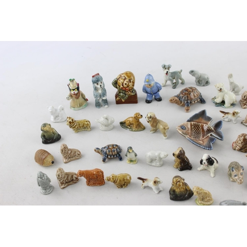 40 - A collection of vintage Wade Whimsies to include Disney, Lady and The Tramp, zoo etc.