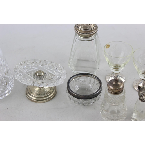 42 - Ten pieces of vintage cut glass tableware, some with .800, .835 and .925 silver tops