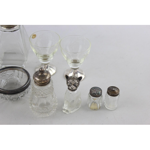 42 - Ten pieces of vintage cut glass tableware, some with .800, .835 and .925 silver tops