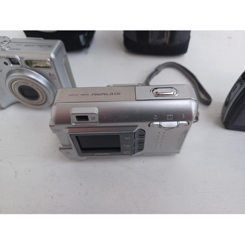 512 - Three digital cameras, one Olympus SZ-10 14mp, one cased Fujifilm FinePix A330 3.2mp and one cased C... 