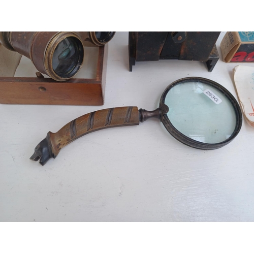 513 - Five items, one pair of military binoculars marked broad arrow 2144 6E/338, one Pathéscope Ace 9.5mm... 