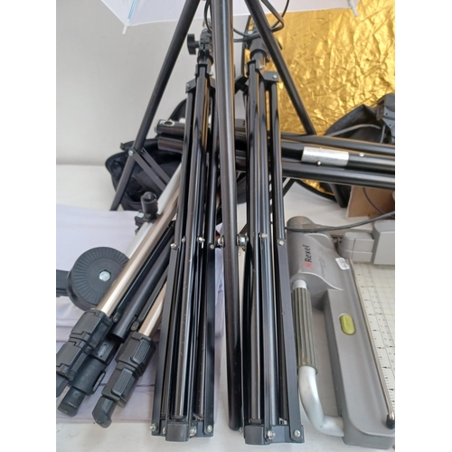 514 - A collection of photographic lighting equipment and accessories to include Velon CX300 tripod, boxed... 