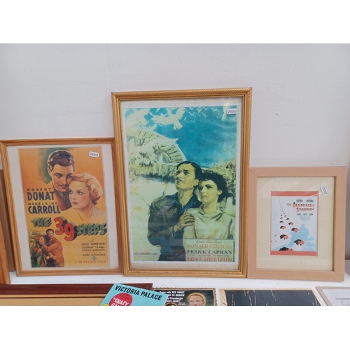 523 - A collection of movie and theatre memorabilia to include framed Fort Apache poster, Piccadilly Hayri... 