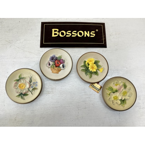 180 - Approx. thirty five boxed Bossons hand painted chalkware circular wall plaques comprising four Summe... 