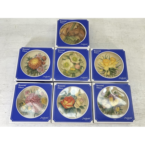 180 - Approx. thirty five boxed Bossons hand painted chalkware circular wall plaques comprising four Summe... 