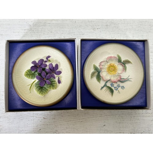 180 - Approx. thirty five boxed Bossons hand painted chalkware circular wall plaques comprising four Summe... 