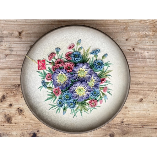 58 - Seven boxed Bossons hand painted chalkware floral wall plaques to include Floral Spray, Camellia etc... 