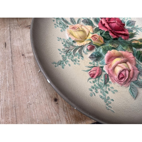 59 - Ten Bossons hand painted chalkware circular wall plaques to include The Arrival, Spring Flowers etc.