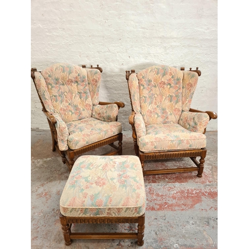 371 - An Ercol elm and floral upholstered four piece lounge suite comprising two seater sofa, two armchair... 