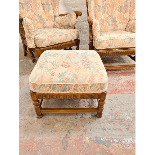 371 - An Ercol elm and floral upholstered four piece lounge suite comprising two seater sofa, two armchair... 