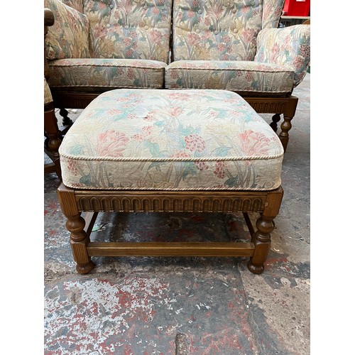 371 - An Ercol elm and floral upholstered four piece lounge suite comprising two seater sofa, two armchair... 