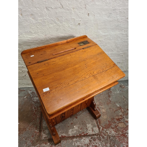 384 - A Victorian pitch pine headmaster's desk - approx. 97cm high x 66cm wide x 55cm deep