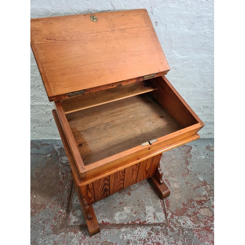 384 - A Victorian pitch pine headmaster's desk - approx. 97cm high x 66cm wide x 55cm deep