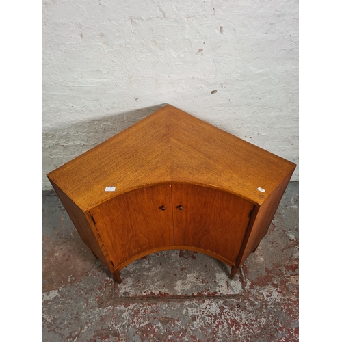 430 - A 1965 Greaves & Thomas teak two door corner cabinet - approx. 74cm high x 104cm wide x 78cm deep