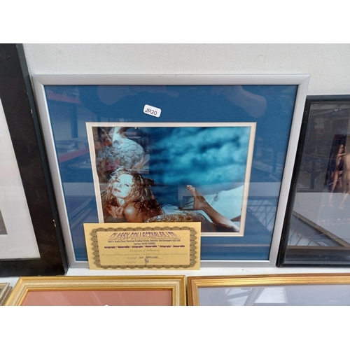 536 - A collection of seven framed signed photographs, some with certificates of authenticity to include L... 