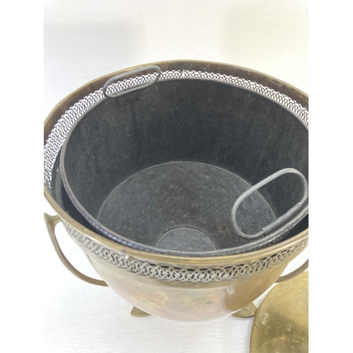 189 - A 19th century style brass circular lidded coal bucket with pierced border, three padded feet and ti... 