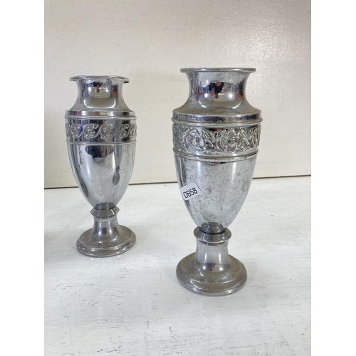 202 - Five vintage chrome plated vases, four 20cm high with floral design and one 26cm high